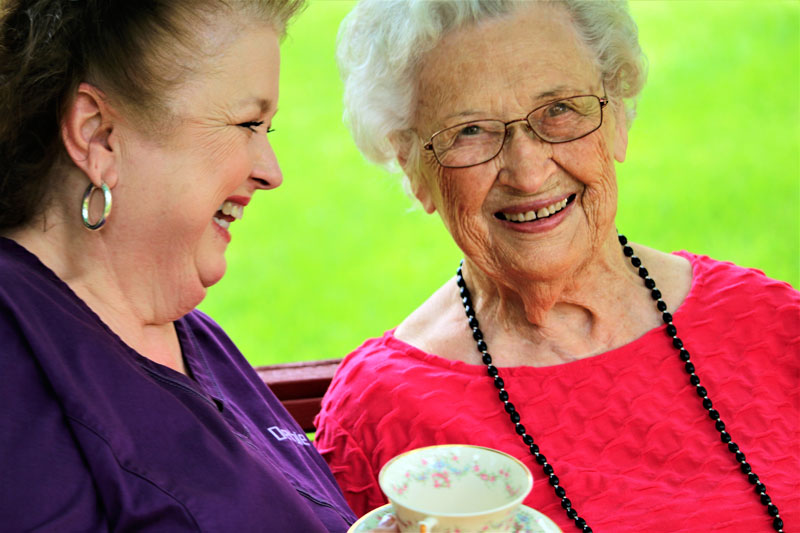 Beaumont home health client and caregiver sharing tea in Top-Rated Home Care Agency