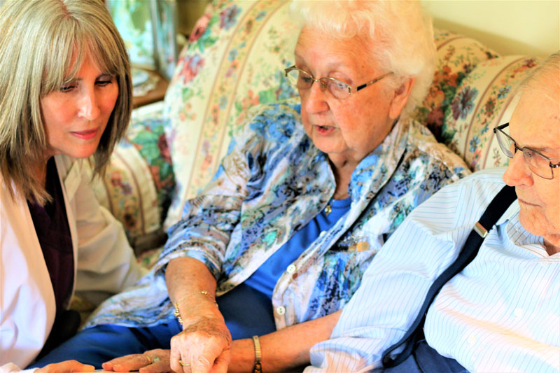 A senior asks home care questions of a senior care provider.