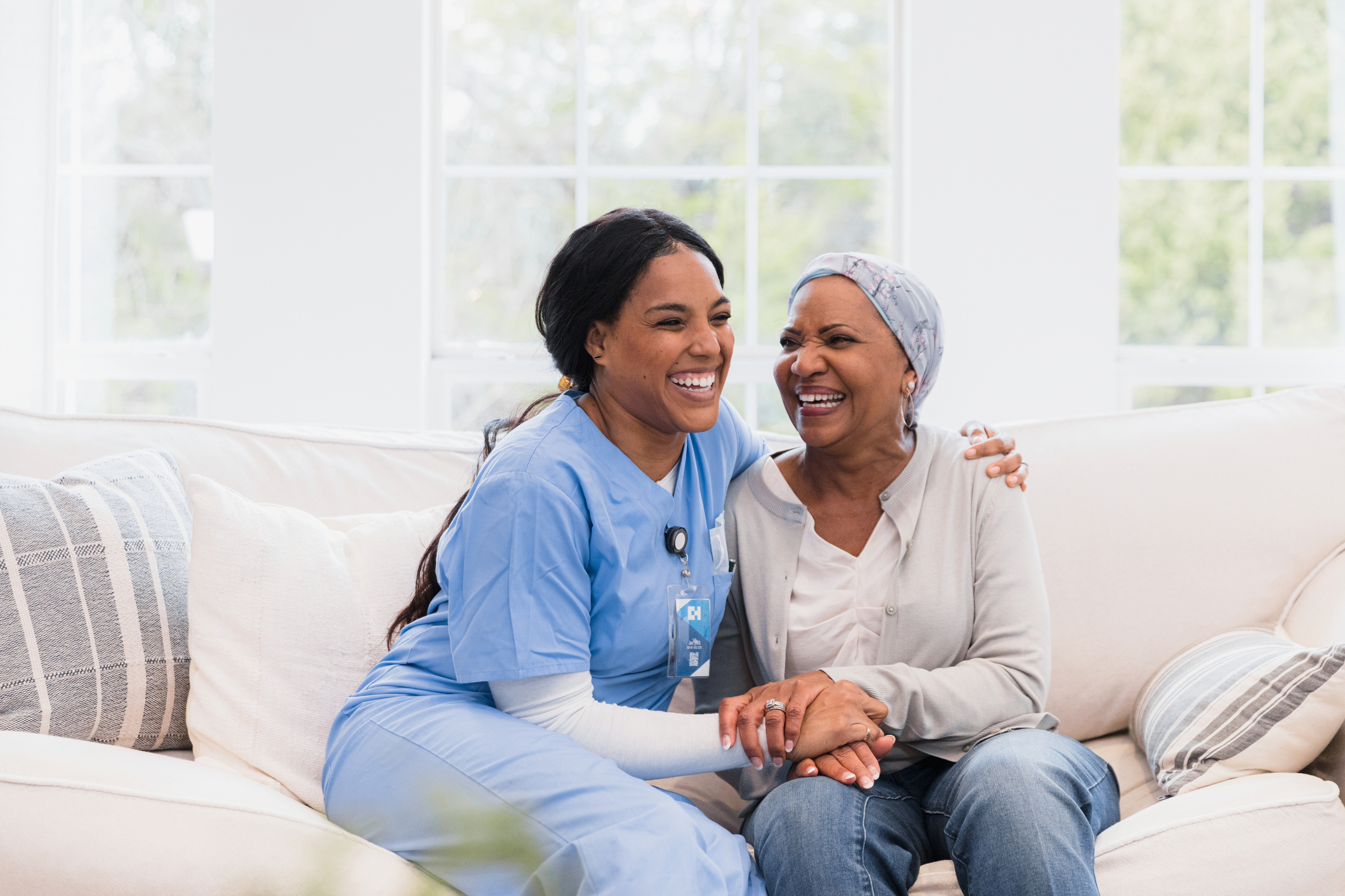 A senior asks home care questions of a senior care provider.