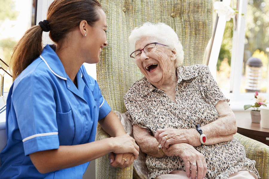 A senior asks home care questions of a senior care provider.
