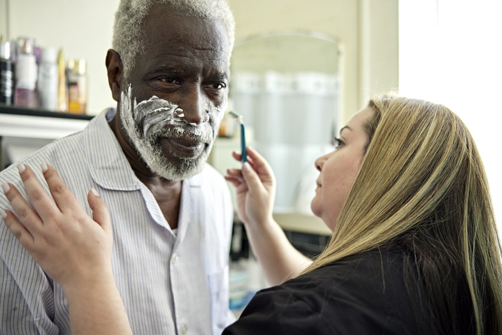 A senior asks home care questions of a senior care provider.