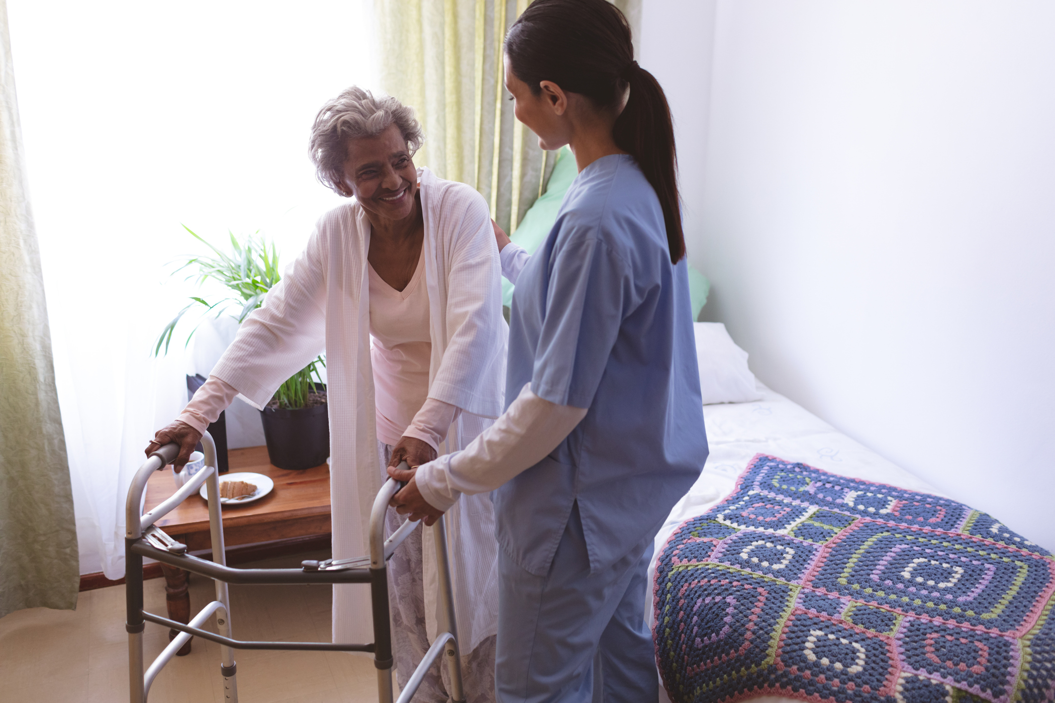 A senior asks home care questions of a senior care provider.